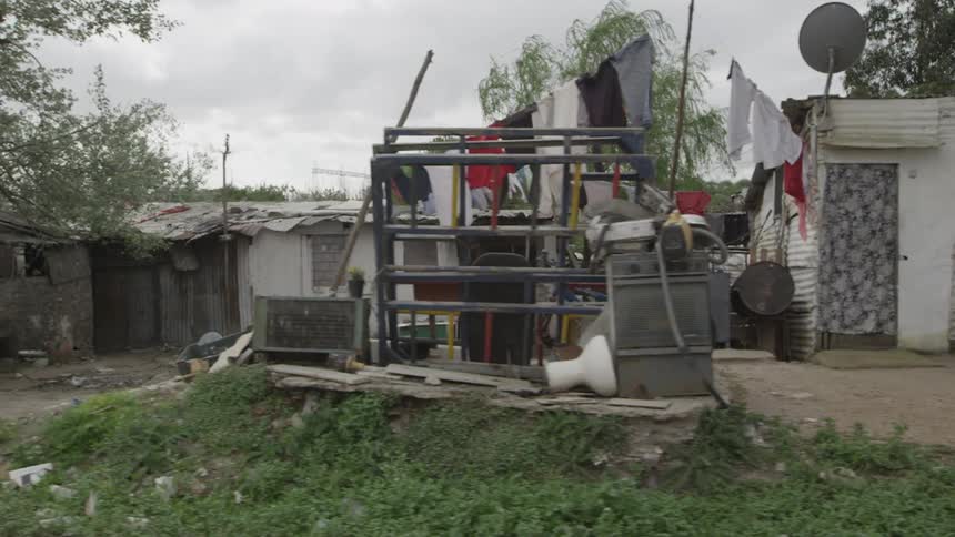 A poverty stricken village is shown